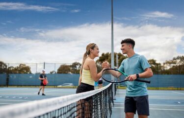 tennis australia players on court shaking hands