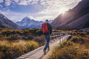 intrepid travel - sbt - anthesis - man hiking in mountains