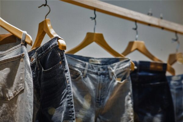 jeans on clothing rack