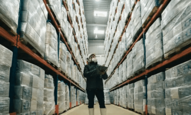 a person in checking stock in a warehouse